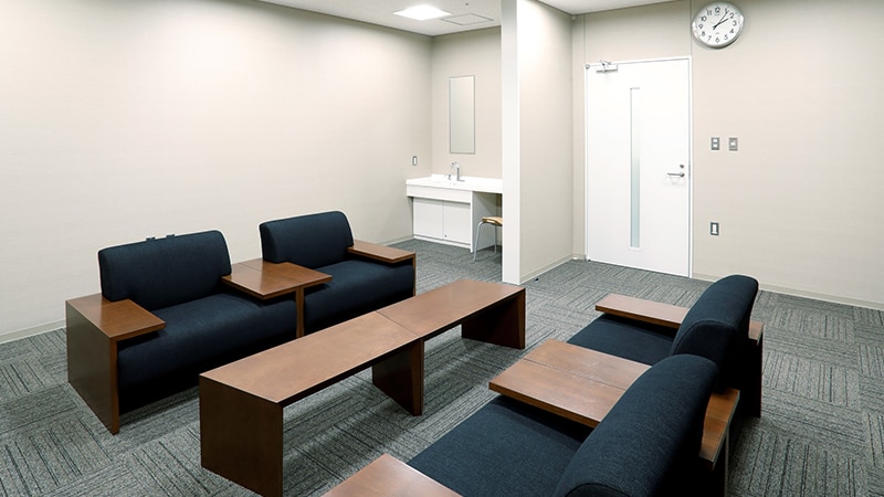 A special waiting room with a sofa and table.